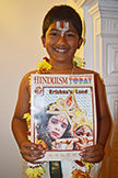  London boy holding Hinduism Today