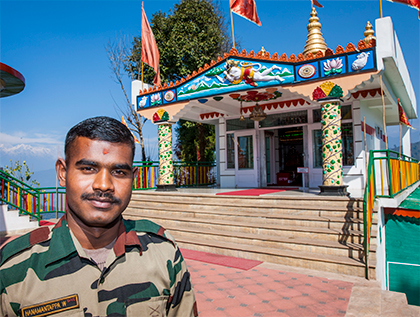 Soldier-priest in front of Hanuman Tok temple